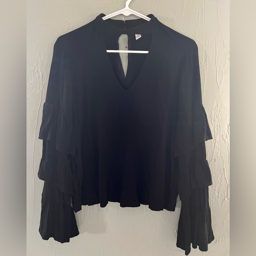 Long sleeve, bell sleeve, black shirt with cut out on neck size medium